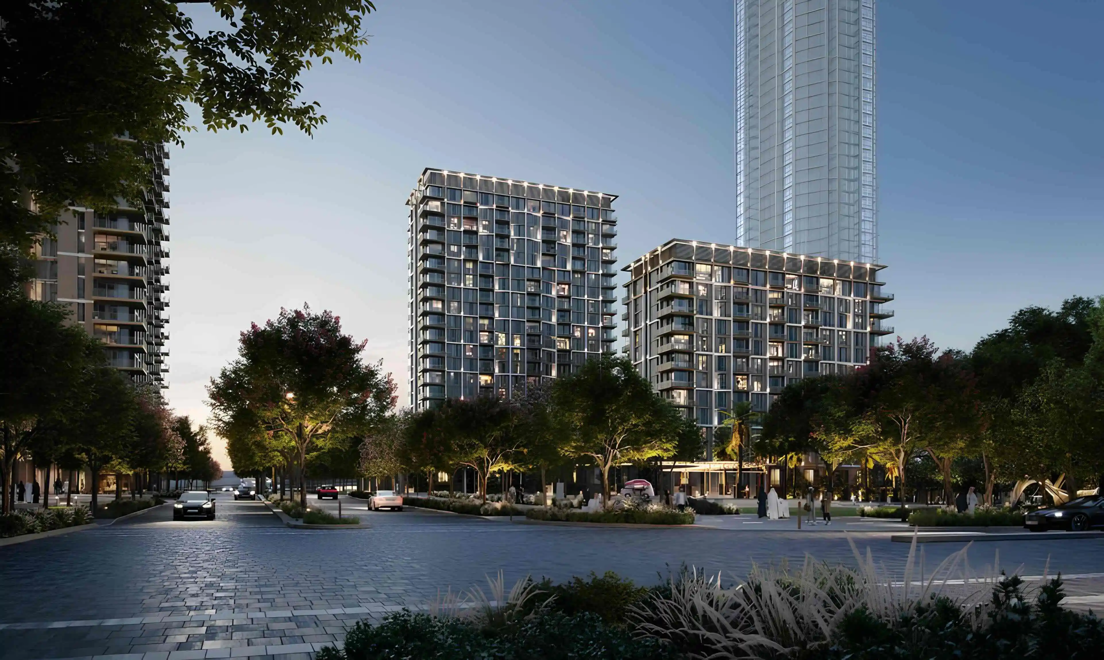 Aeon towers and landscaped Dubai Creek Harbour streetscape at dusk