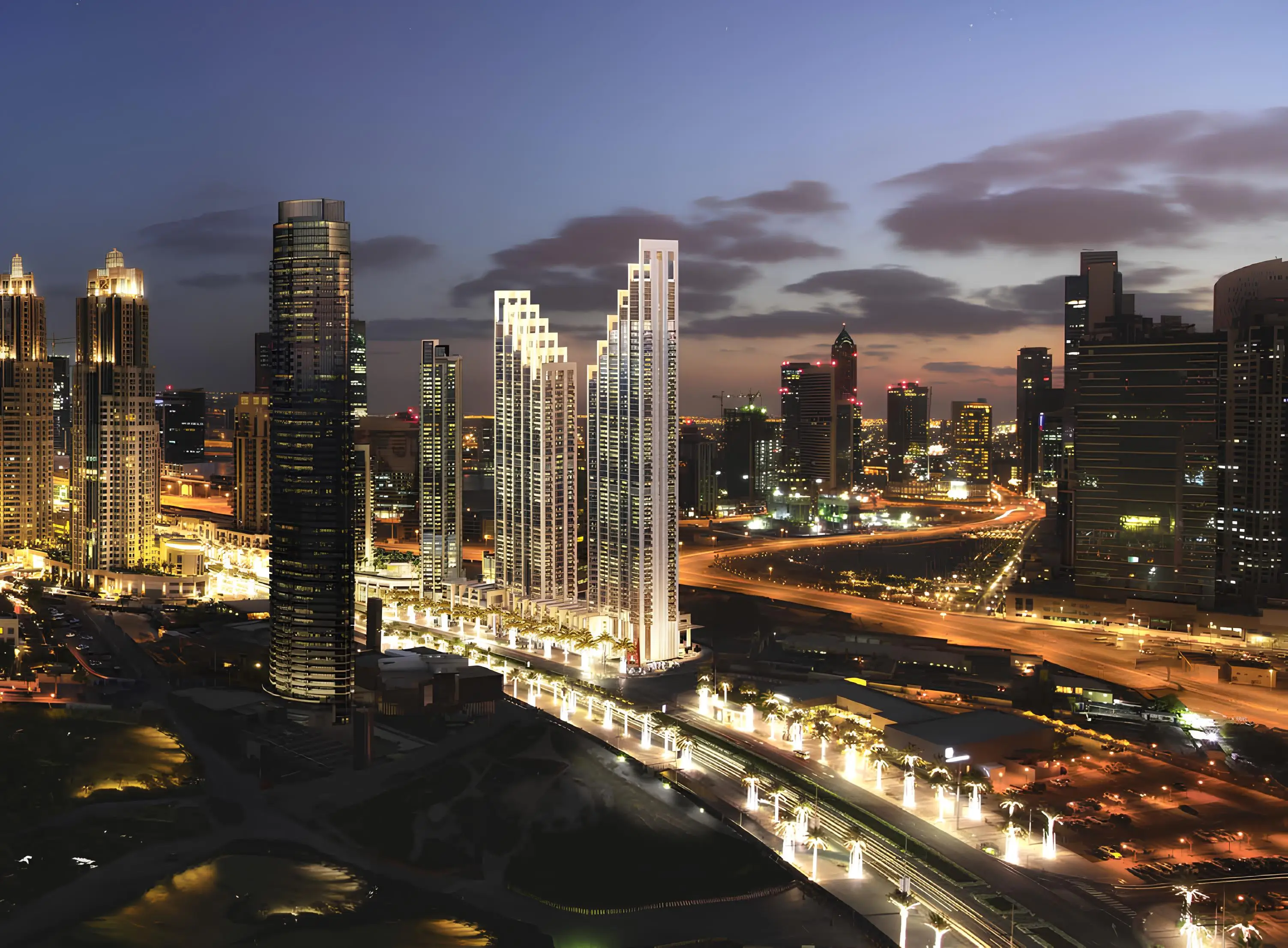 BLVD Heights towers illuminated in the Downtown Dubai skyline