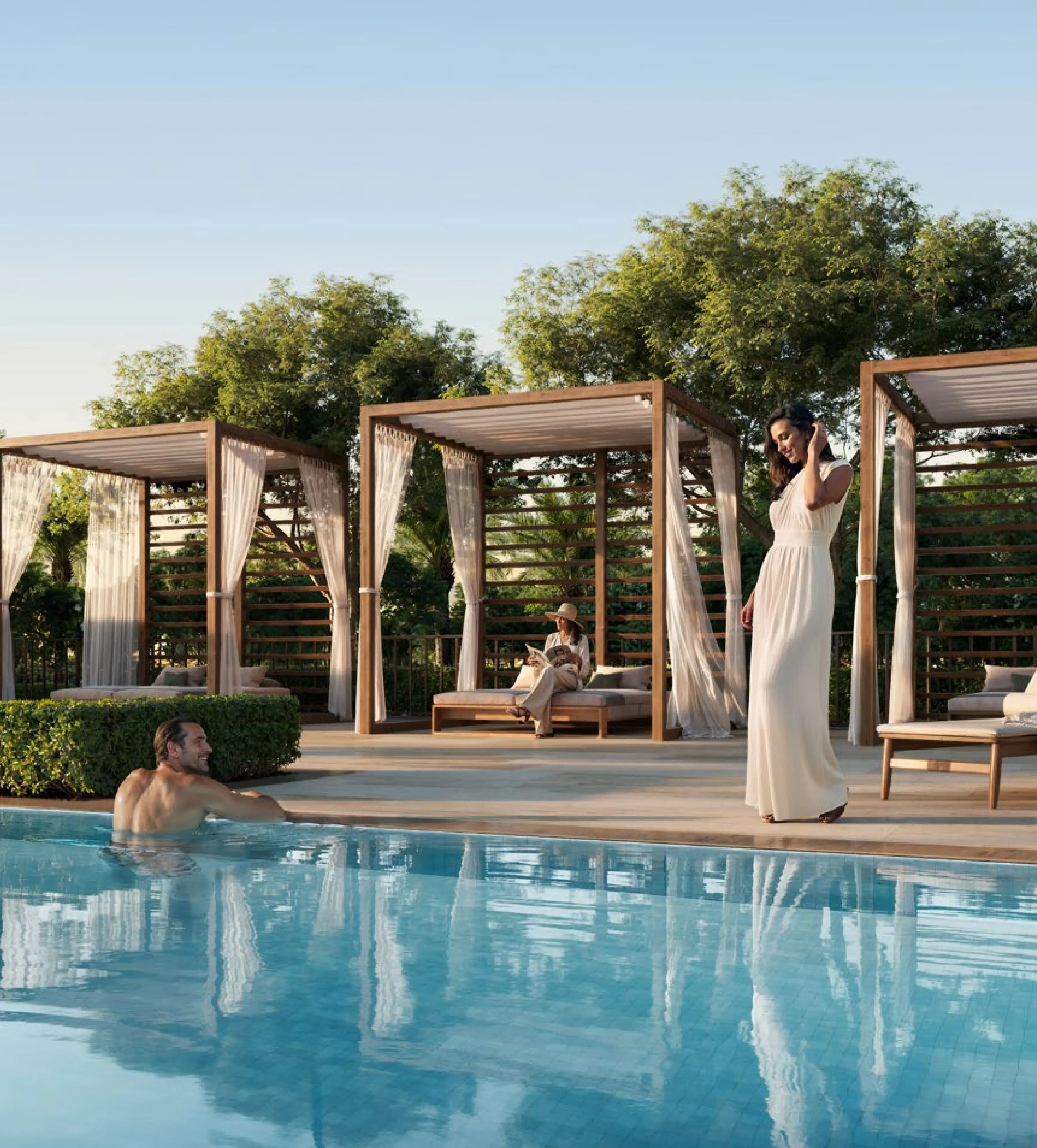 Creek Haven infinity pool with landscaped cabanas