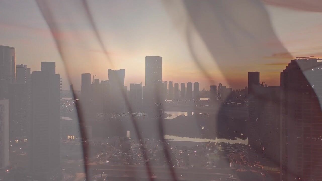 Abu Dhabi skyline seen through a silk veil from Elie Saab Waterfront on Al Reem Island