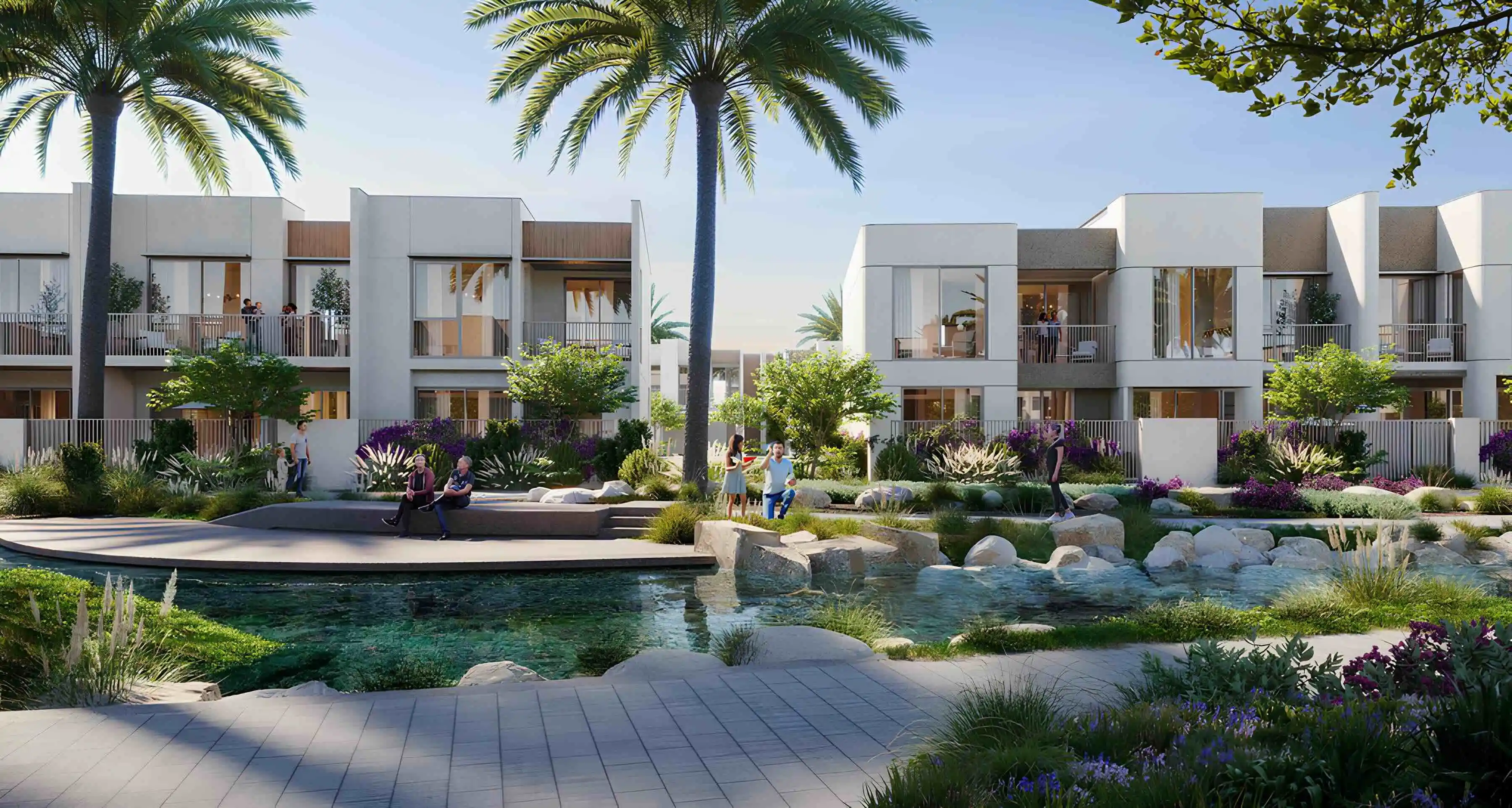 Nima townhouses beside a landscaped waterway