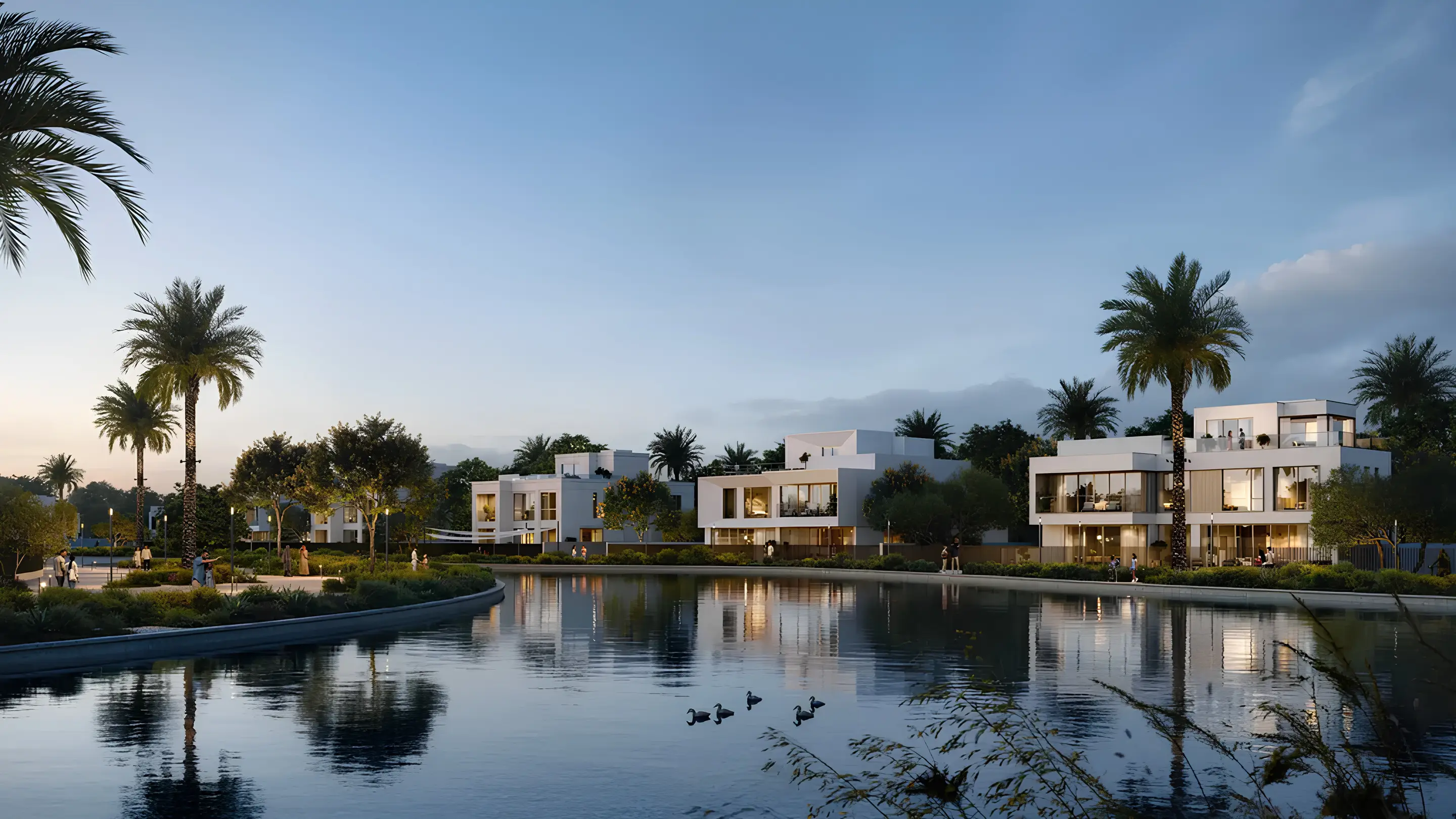 Palace Villas Ostra homes along a lagoon at sunset