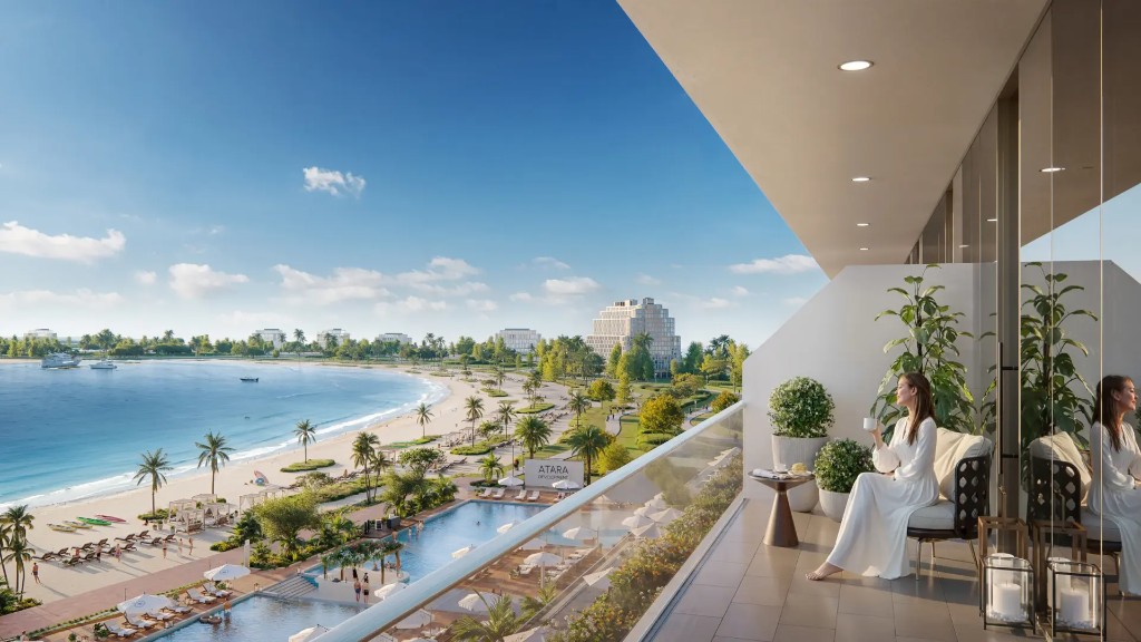 Balcony lifestyle view over pool deck and private beach at Sheraton Residences Al Marjan Island