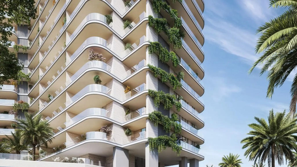 Curved cream balconies with vertical greenery at Vienna House Residences