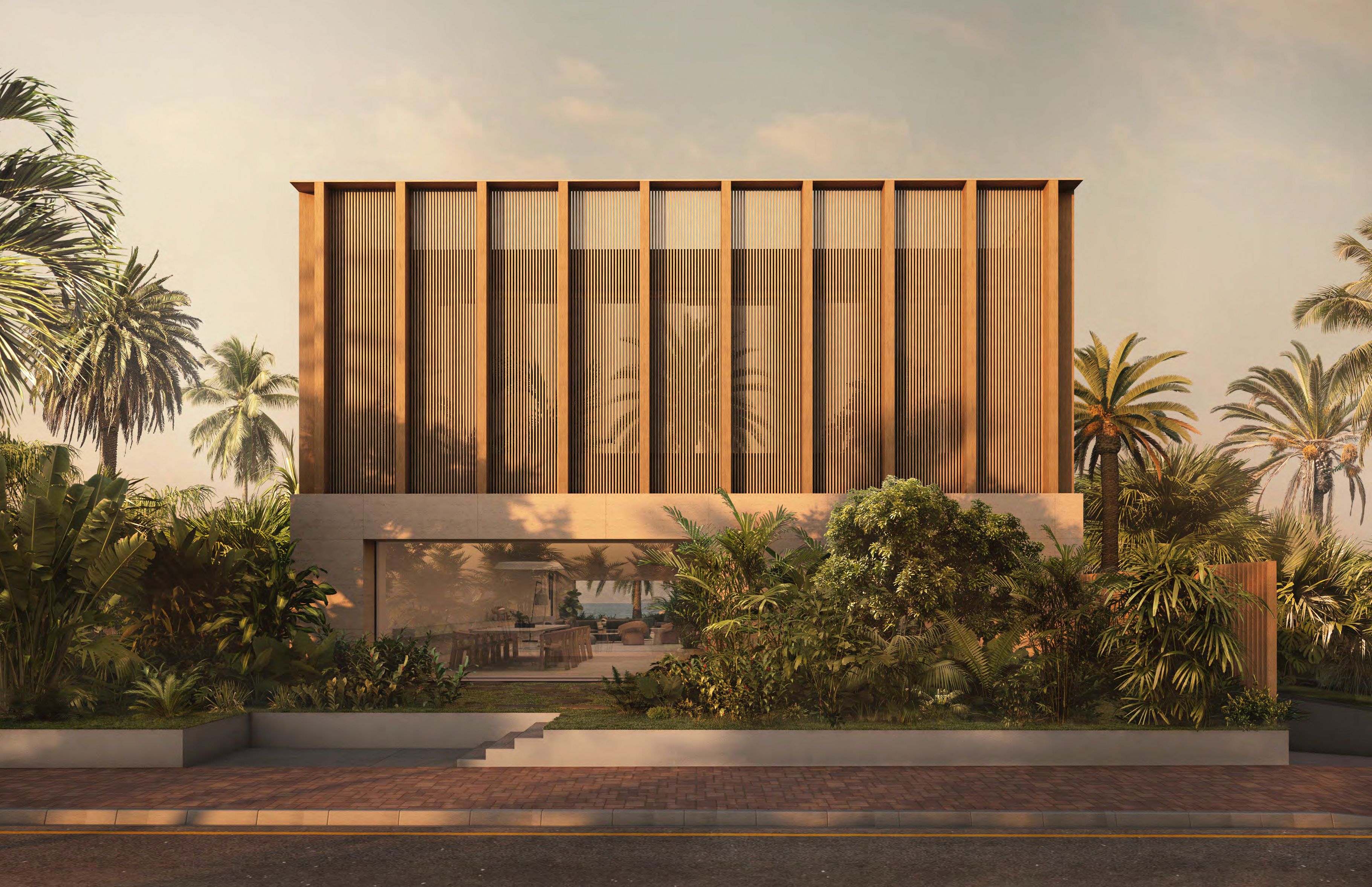Vertical copper facade of a Sea Mirror villa behind tropical planting on Jumeirah Bay Island