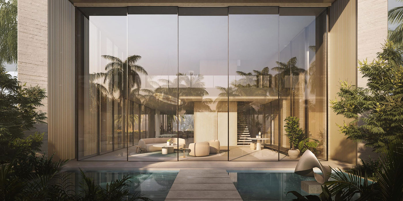 Stone walkway across a pool toward a glass Sea Mirror villa facade on Jumeirah Bay Island