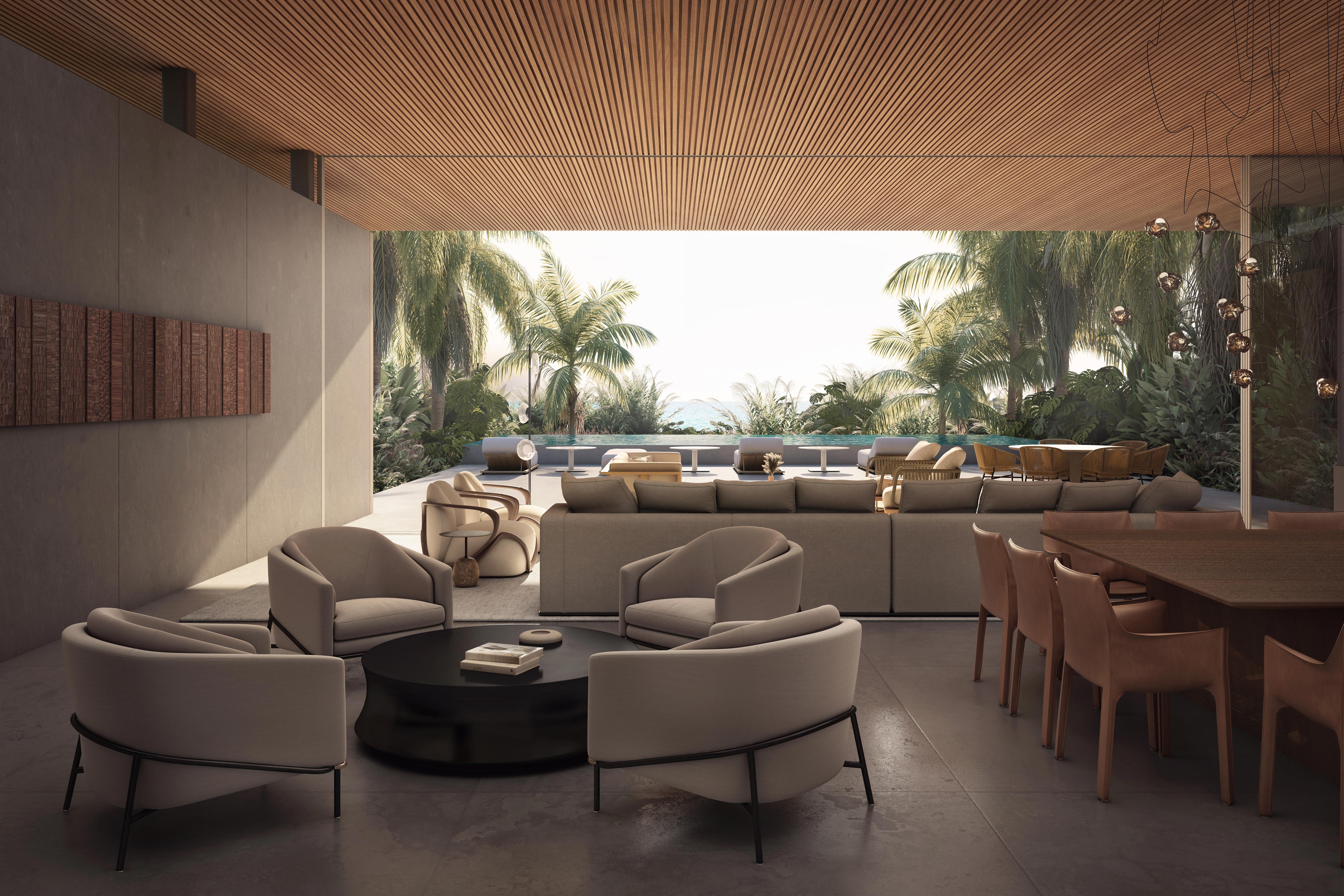 Open-plan Sea Mirror villa interior on Jumeirah Bay Island looking out to an infinity pool and garden