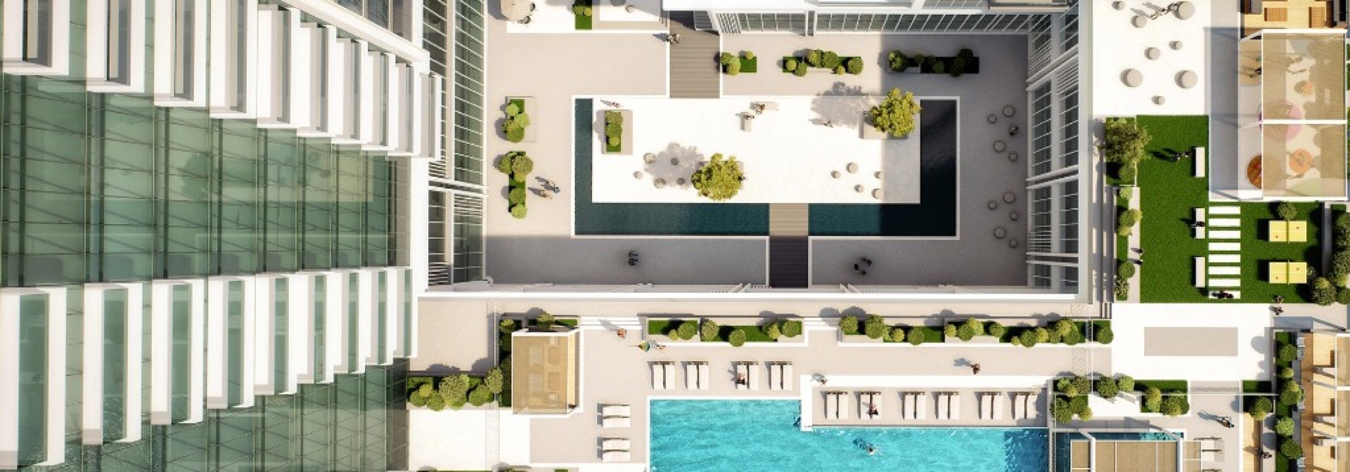 Aerial view of swimming pool, landscaped deck and amenity levels at Wasl 1