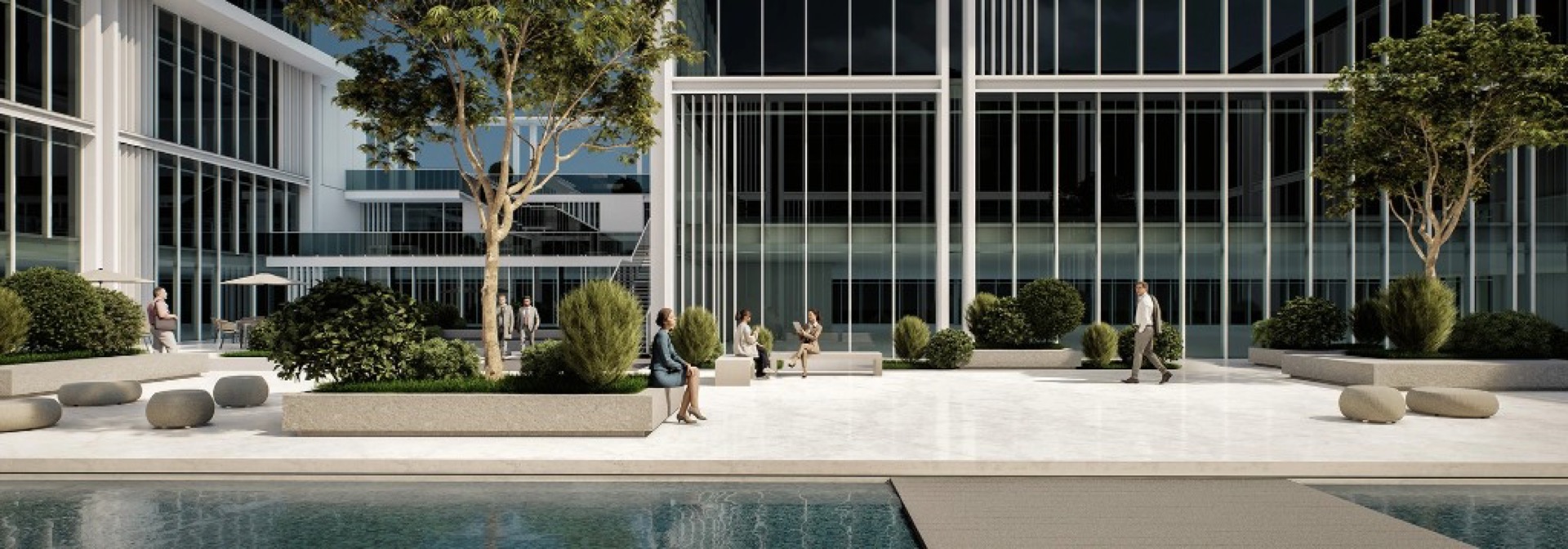 Landscaped courtyard with water feature and outdoor seating at Wasl 1